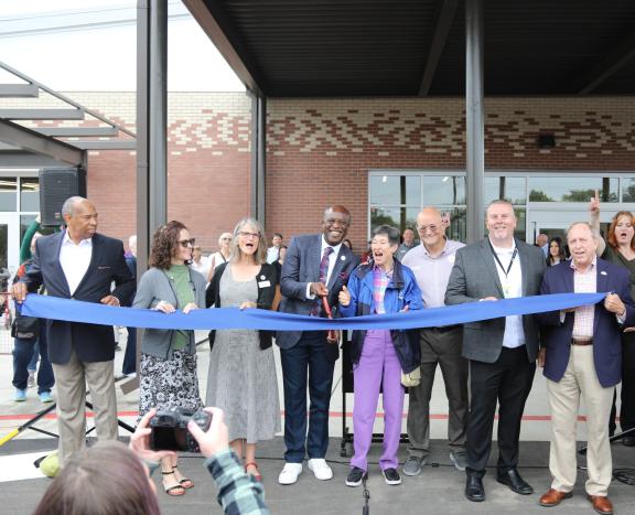 Mayor Yemi and other honored attendees cut the ribbon on the new Colorado Springs Senior Center