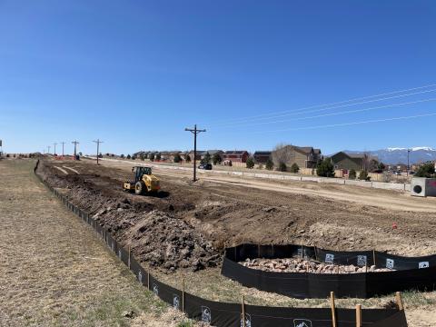 Grading being done with a construction vehicle near Tarren Heights.