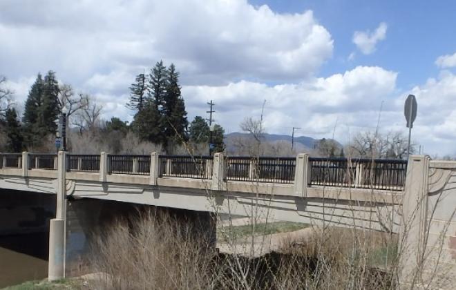 A wide shot of the Cache La Poudre bridge over Monument Creek